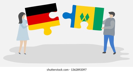 Couple holding two puzzles pieces with German and Vincentian flags. Germany and Saint Vincent and the Grenadines national symbols together.