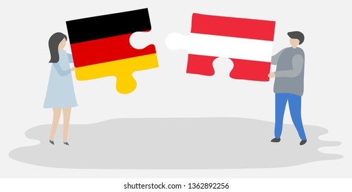 Couple holding two puzzles pieces with German and Austrian flags. Germany and Austria national symbols together.