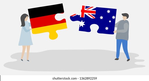 Couple holding two puzzles pieces with German and Australian flags. Germany and Australia national symbols together.
