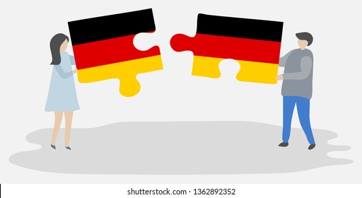 Couple holding two puzzles pieces with German and German flags. Germany and Germany national symbols together.