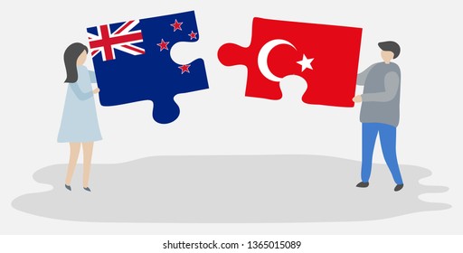 Couple holding two puzzles pieces with NZ and Turkish flags. New Zealand and Turkey national symbols together.