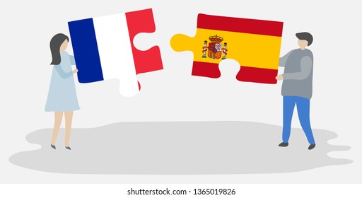 Couple holding two puzzles pieces with French and Spanish flags. France and Spain national symbols together.