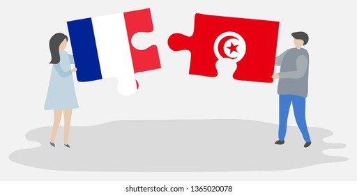 Couple holding two puzzles pieces with French and Tunisian flags. France and Tunisia national symbols together.