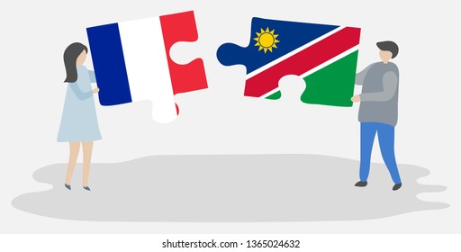 Couple holding two puzzles pieces with French and Namibian flags. France and Namibia national symbols together.