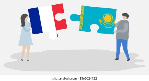 Couple holding two puzzles pieces with French and Kazakh flags. France and Kazakhstan national symbols together.