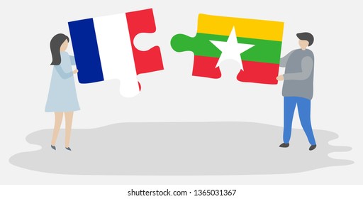 Couple holding two puzzles pieces with French and Burmese flags. France and Myanmar national symbols together.