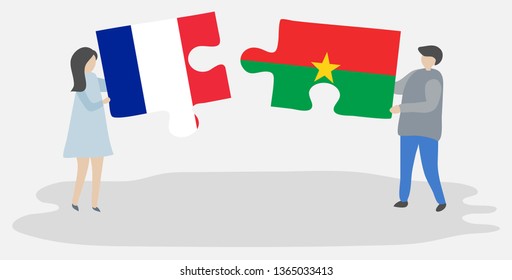 Couple holding two puzzles pieces with French and Burkinabe flags. France and Burkina Faso national symbols together.