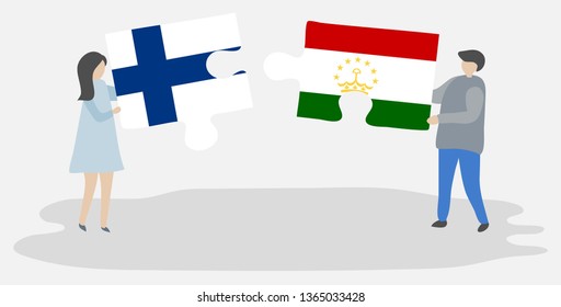 Couple holding two puzzles pieces with Finnish and Tajikistani flags. Finland and Tajikistan national symbols together.