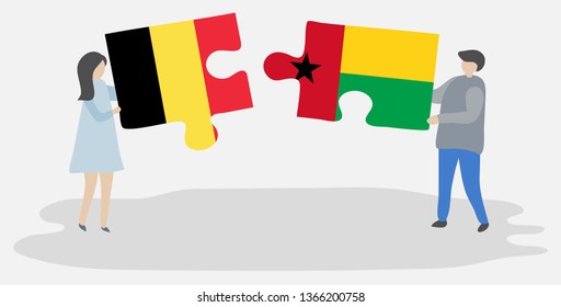 Couple holding two puzzles pieces with Belgian and Bissau-Guinean flags. Belgium and Guinea-Bissau national symbols together.