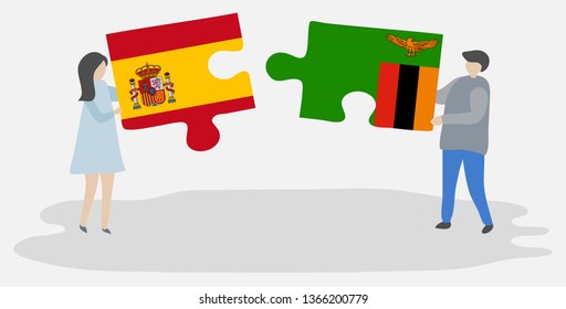 Couple holding two puzzles pieces with Spanish and Zambian flags. Spain and Zambia national symbols together.