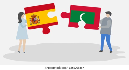 Couple holding two puzzles pieces with Spanish and Maldivian flags. Spain and Maldives national symbols together.