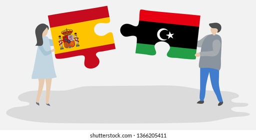 Couple holding two puzzles pieces with Spanish and Libyan flags. Spain and Libya national symbols together.