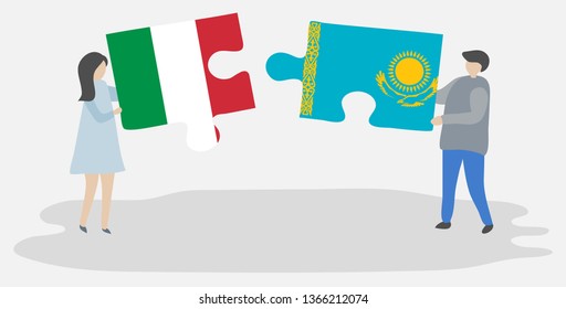 Couple holding two puzzles pieces with Italian and Kazakh flags. Italy and Kazakhstan national symbols together.