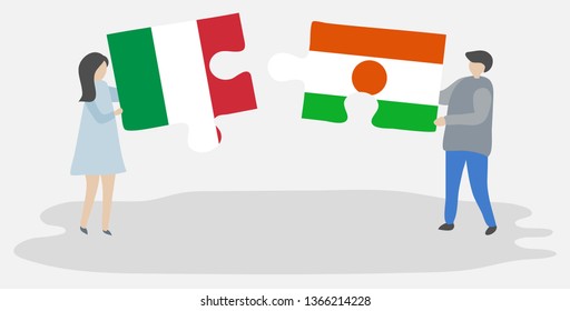 Couple holding two puzzles pieces with Italian and Nigerien flags. Italy and Niger national symbols together.