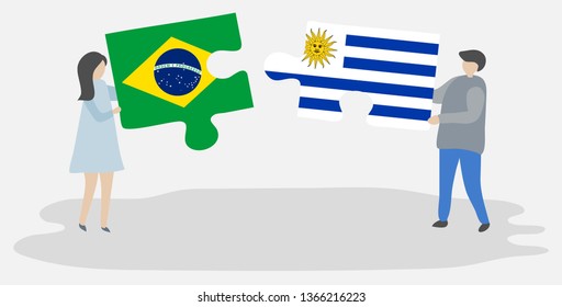 Couple holding two puzzles pieces with Brazilian and Uruguayan flags. Brazil and Uruguay national symbols together.