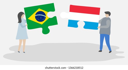 Couple holding two puzzles pieces with Brazilian and Luxembourgish flags. Brazil and Luxembourg national symbols together.