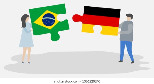 Couple holding two puzzles pieces with Brazilian and German flags. Brazil and Germany national symbols together.