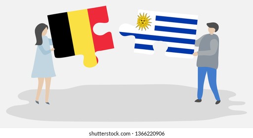 Couple holding two puzzles pieces with Belgian and Uruguayan flags. Belgium and Uruguay national symbols together.