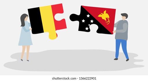 Couple holding two puzzles pieces with Belgian and Papuan flags. Belgium and Papua New Guinea national symbols together.