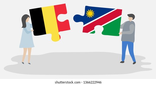 Couple holding two puzzles pieces with Belgian and Namibian flags. Belgium and Namibia national symbols together.