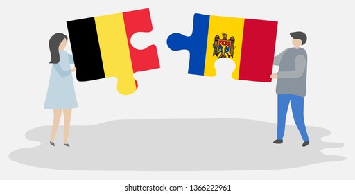 Couple holding two puzzles pieces with Belgian and Moldovan flags. Belgium and Moldova national symbols together.