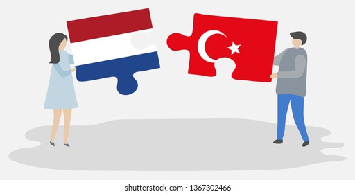 Couple holding two puzzles pieces with Dutch and Turkish flags. Netherlands and Turkey national symbols together.