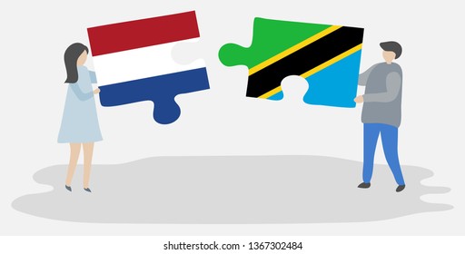 Couple holding two puzzles pieces with Dutch and Tanzanian flags. Netherlands and Tanzania national symbols together.