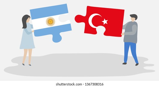 Couple holding two puzzles pieces with Argentine and Turkish flags. Argentina and Turkey national symbols together.