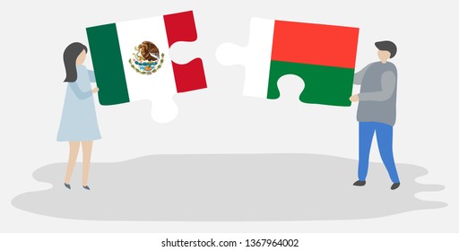 Couple holding two puzzles pieces with Mexican and Malagasy flags. Mexico and Madagascar national symbols together.