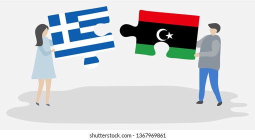 Couple holding two puzzles pieces with Greek and Libyan flags. Greece and Libya national symbols together.