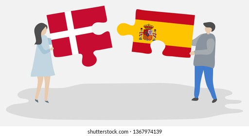 Couple holding two puzzles pieces with Danish and Spanish flags. Denmark and Spain national symbols together.