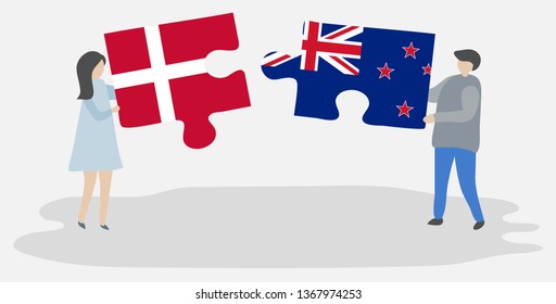 Couple holding two puzzles pieces with Danish and NZ flags. Denmark and New Zealand national symbols together.