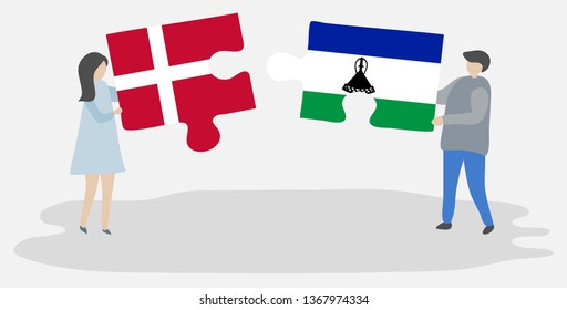 Couple holding two puzzles pieces with Danish and Basotho flags. Denmark and Lesotho national symbols together.