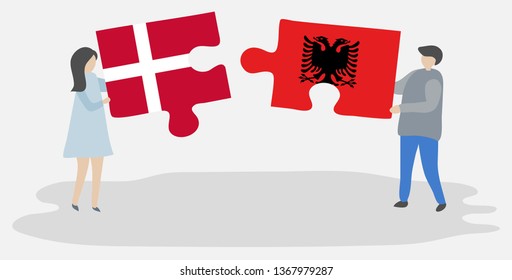 Couple holding two puzzles pieces with Danish and Albanian flags. Denmark and Albania national symbols together.