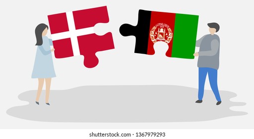 Couple holding two puzzles pieces with Danish and Afghan flags. Denmark and Afghanistan national symbols together.