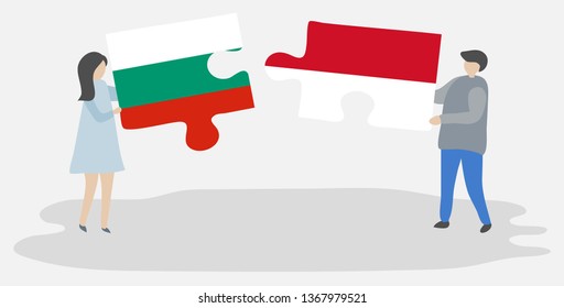 Couple holding two puzzles pieces with Bulgarian and Indonesian flags. Bulgaria and Indonesia national symbols together.