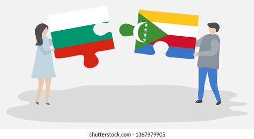 Couple holding two puzzles pieces with Bulgarian and Comoran flags. Bulgaria and Comoros national symbols together.