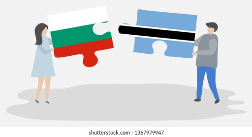 Couple holding two puzzles pieces with Bulgarian and Motswana flags. Bulgaria and Botswana national symbols together.