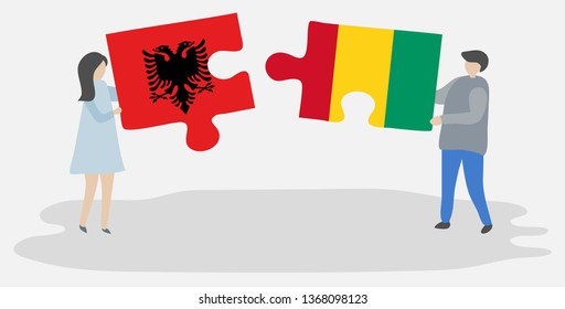Couple holding two puzzles pieces with Albanian and Guinean flags. Albania and Guinea national symbols together.