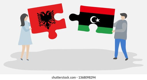 Couple holding two puzzles pieces with Albanian and Libyan flags. Albania and Libya national symbols together.