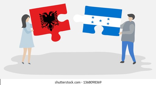 Couple holding two puzzles pieces with Albanian and Honduran flags. Albania and Honduras national symbols together.