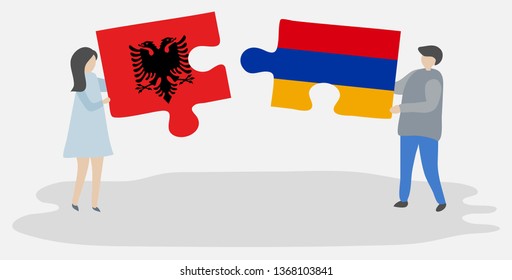 Couple holding two puzzles pieces with Albanian and Armenian flags. Albania and Armenia national symbols together.