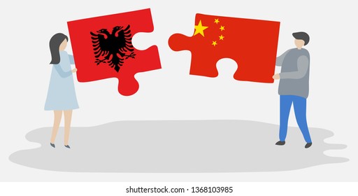 Couple holding two puzzles pieces with Albanian and Chinese flags. Albania and China national symbols together.