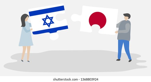 Couple holding two puzzles pieces with Israeli and Japanese flags. Israel and Japan national symbols together.