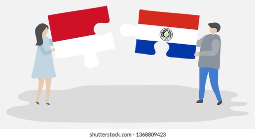 Couple holding two puzzles pieces with Indonesian and Paraguayan flags. Indonesia and Paraguay national symbols together.