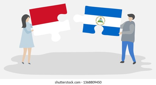Couple holding two puzzles pieces with Indonesian and Nicaraguan flags. Indonesia and Nicaragua national symbols together.
