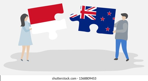 Couple holding two puzzles pieces with Indonesian and NZ flags. Indonesia and New Zealand national symbols together.