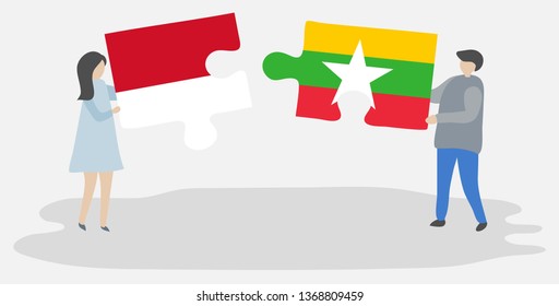 Couple holding two puzzles pieces with Indonesian and Burmese flags. Indonesia and Myanmar national symbols together.