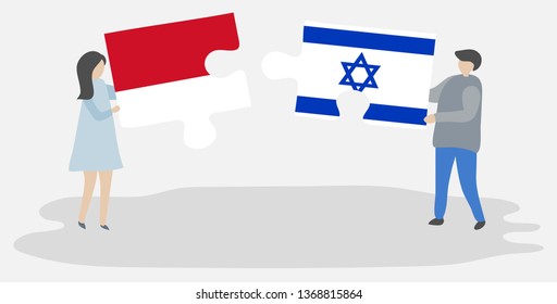 Couple holding two puzzles pieces with Indonesian and Israeli flags. Indonesia and Israel national symbols together.