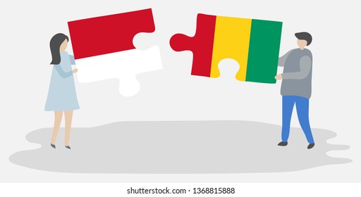 Couple holding two puzzles pieces with Indonesian and Guinean flags. Indonesia and Guinea national symbols together.
